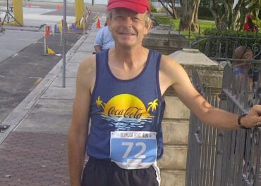 Older adult stretching outdoors before a walk, symbolizing improved flexibility in senior years